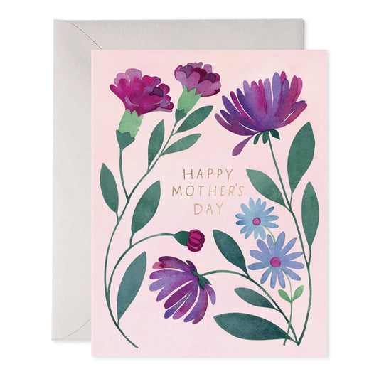 Greeting card with pale pink background and purple flowers. Text: happy Mother’s Day 