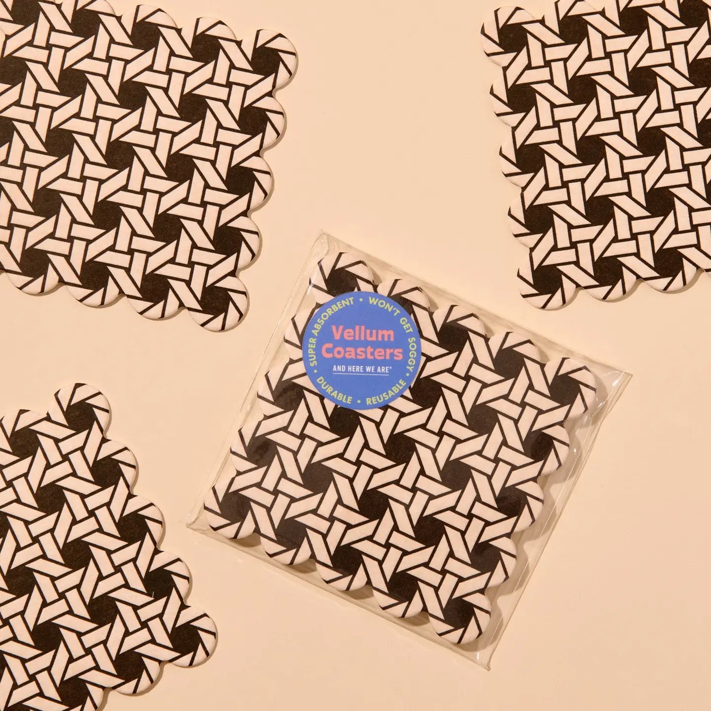 Pack of coasters with a geometric weave pattern on a beige background
