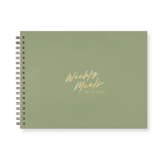 Green spiral notebook with 'Weekly Meals' text on a white background