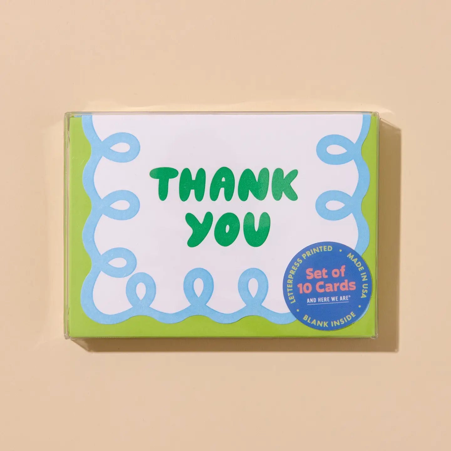 Box of 'Thank You' cards with green text on a beige background