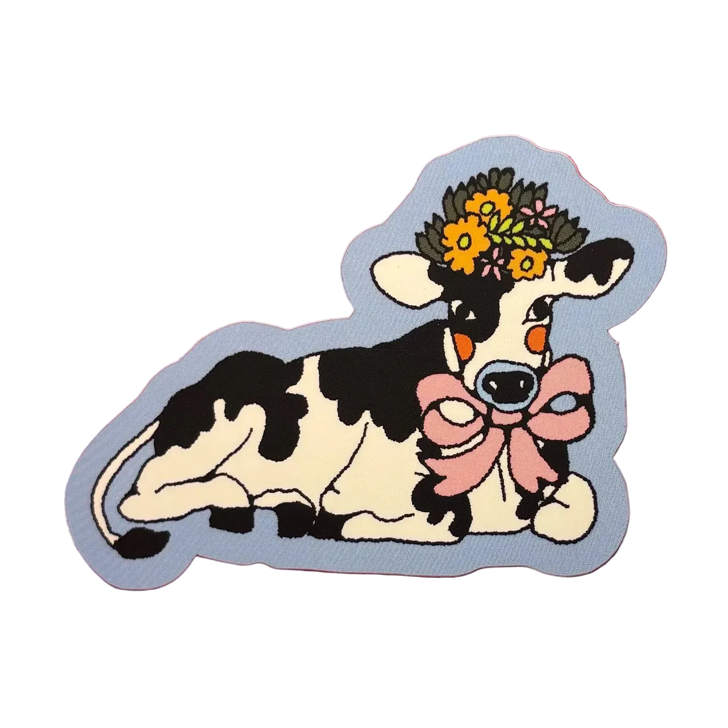 Sticker of a cow with a flower crown and bow on a pink background