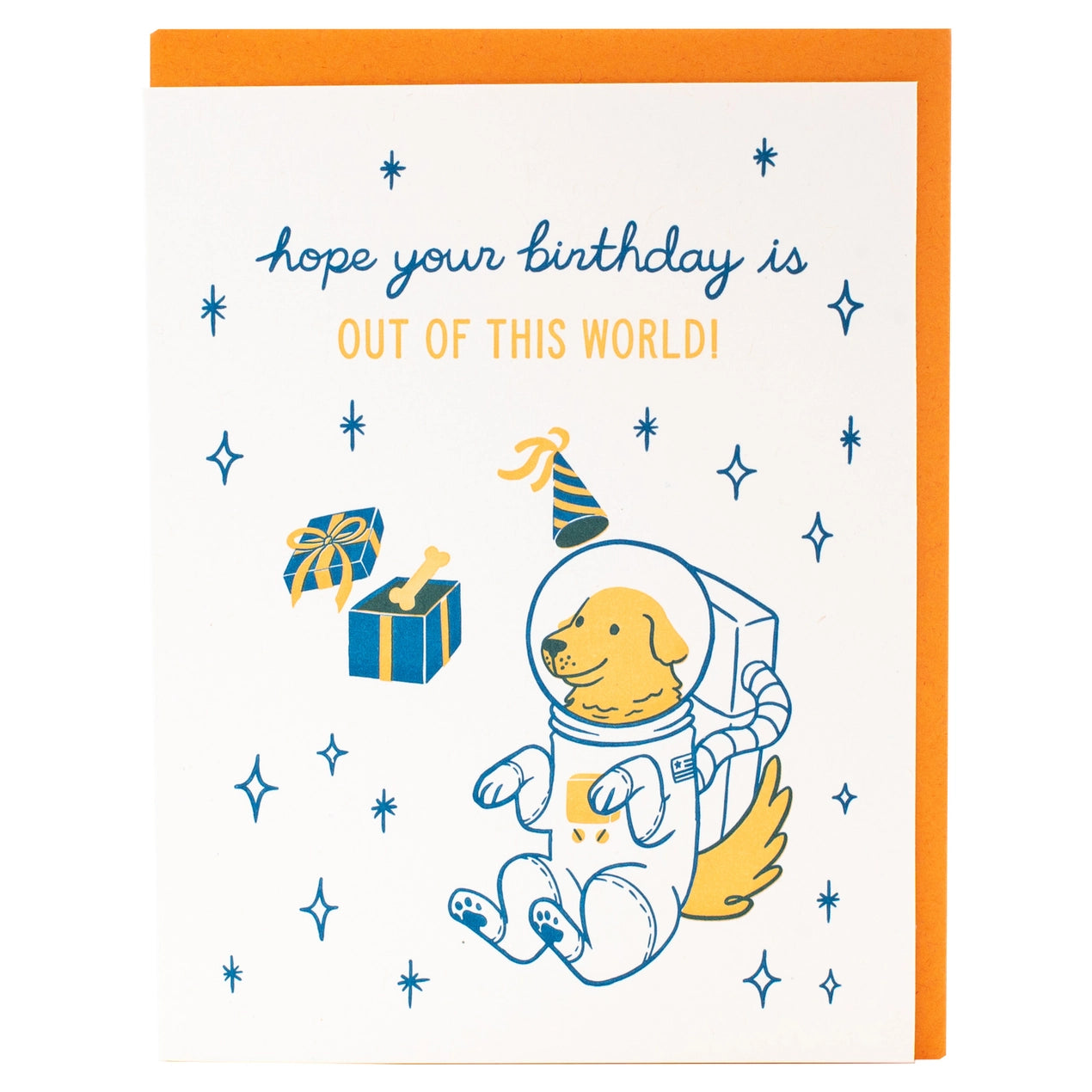 White greeting card with an illustration of a dog in a space suit. Blue and yellow text: hope your birthday is out of this world 