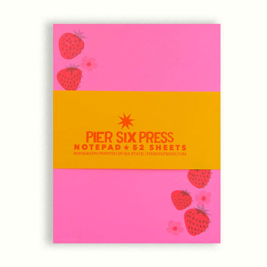 Pink notepad with red strawberry illustrations 