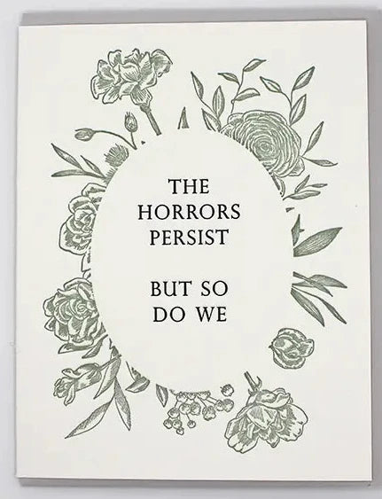 White greeting card with floral design and black text