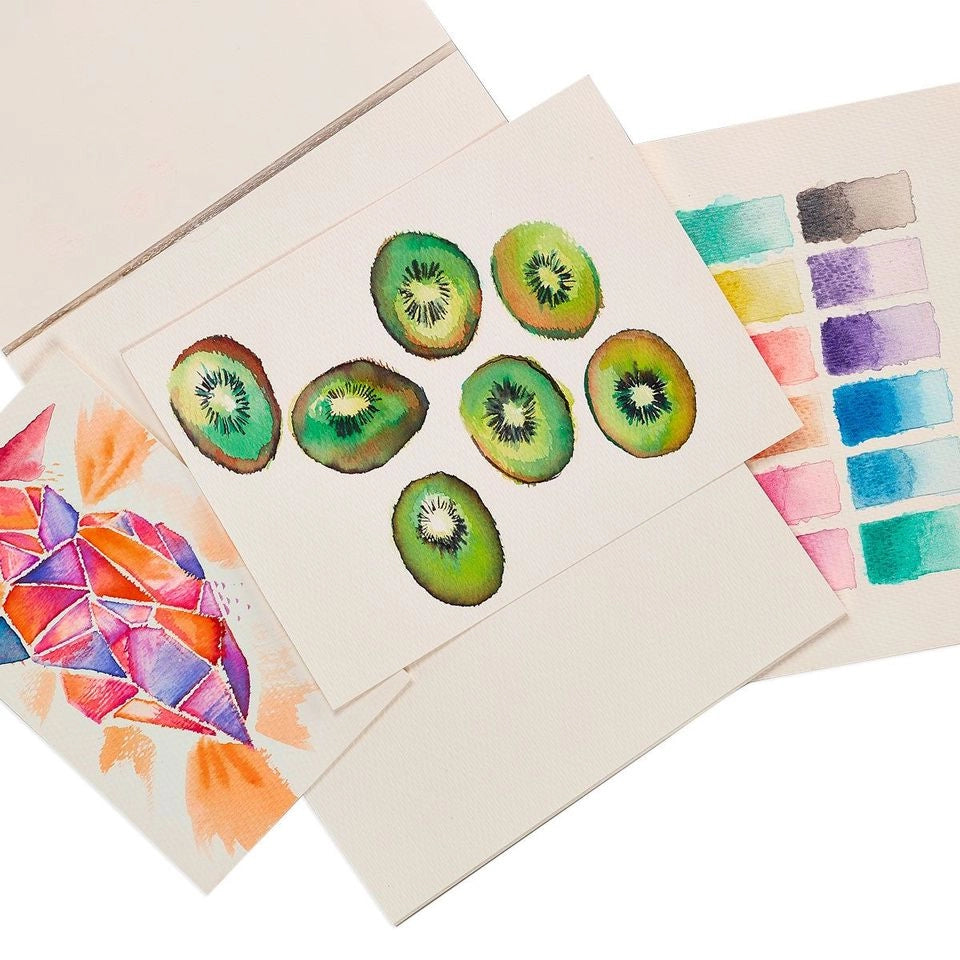 Example of watercolor paper with kiwi paintings and color swatches.