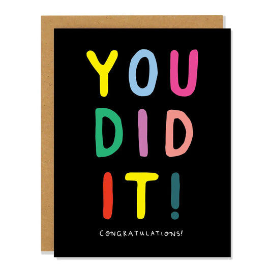 Greeting card with colorful text 'YOU DID IT! CONGRATULATIONS!' on a black background