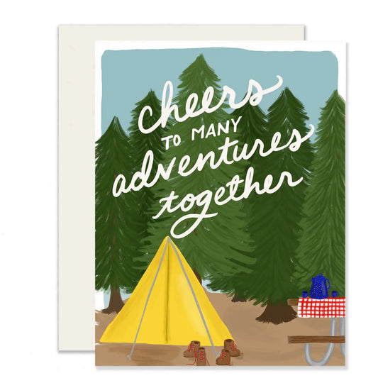 Greeting card. Tent with trees behind it. Cheers to many adventures together in white text