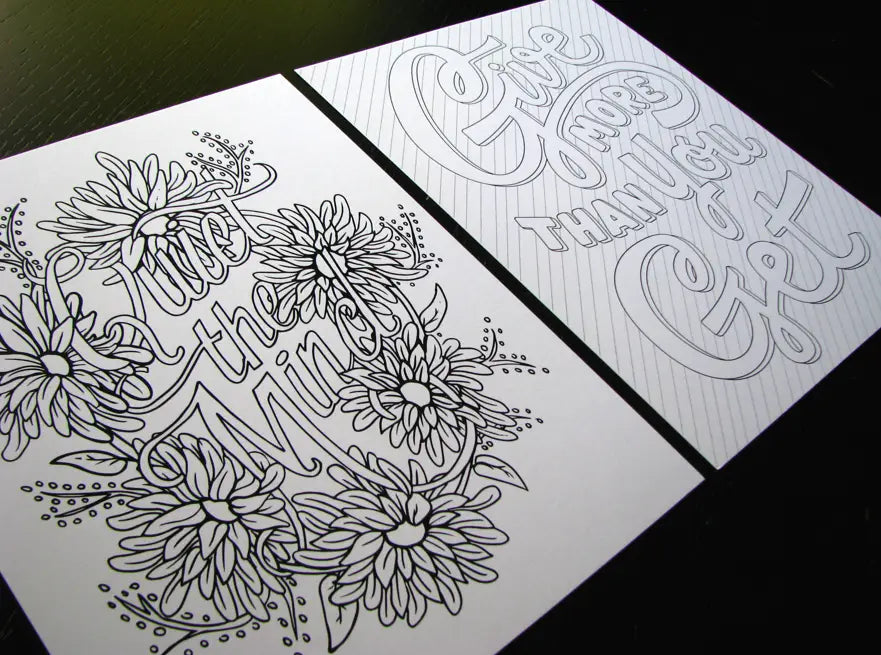 Two pages from inside of coloring book. White paper and black outlines. Left side is block letters reading "quiet the mind." Right side is block letters reading "give more than you get"