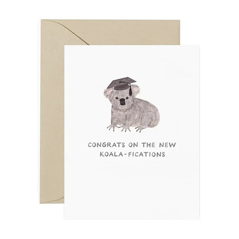 White card with koala wearing graduation cap. Black text reads "congrats on the new koala-fications"