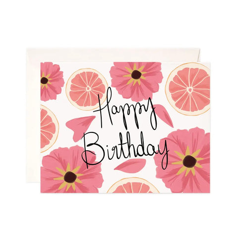 White card with illustrations of pink flowers and pink grapefruits. Black text reads "happy birthday"