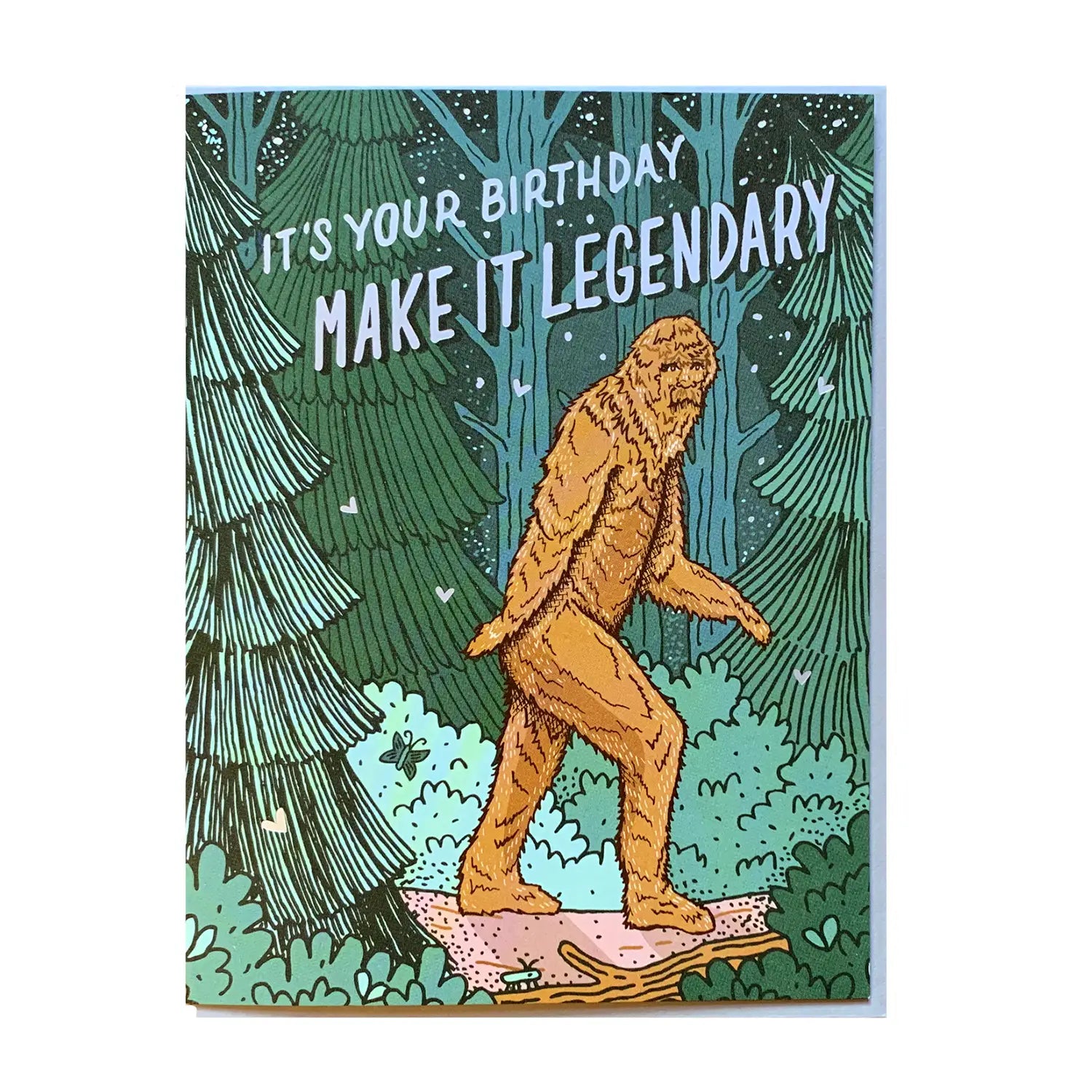 White card with shades of green forest and a brown big foot walking. Light blue block letters read "it's your birthday, make it legendary"