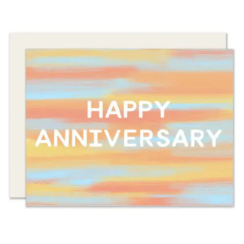 Blue, orange, and yellow gradient card. White text reads "happy anniversary" 