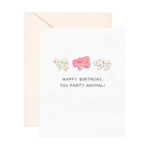 White card with white and pink animal crackers. Black text reads "happy birthday, you party animal!"