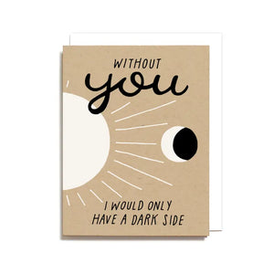 Brown kraft paper card. Black text reads "without you I would only have a dark side." Black and white sun and moon drawing. 