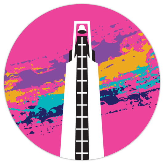 Vinyl circle-shaped sticker. Pink background with a black and white drawing of a bell tower. Turqouise, navy, mustard, and purple splotches behind the bell tower.