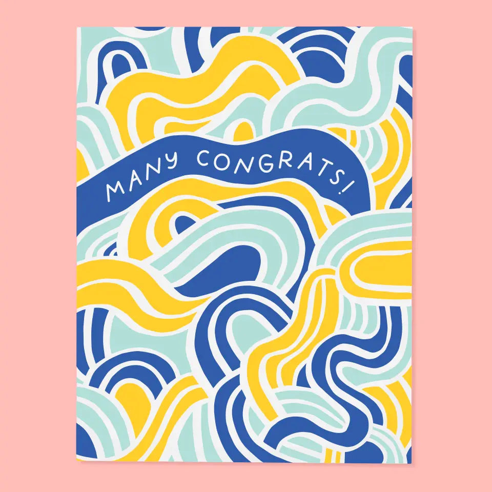 White greeting card with blue and yellow swirl design. White text “many congrats!”