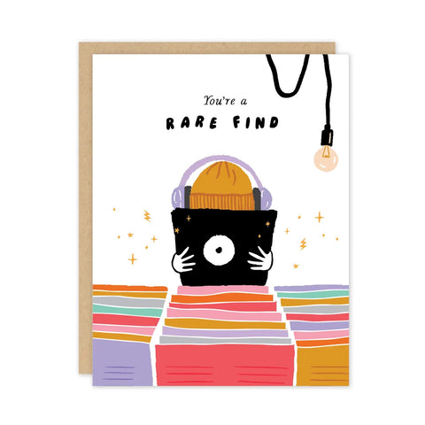 White card with person wearing a hat and headphone holding vinyl album. Black text reads "you're a rare find"