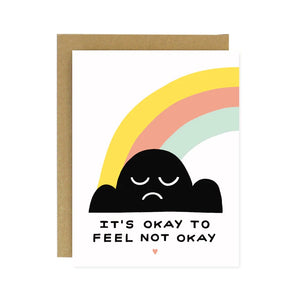 White card with black cloud and rainbow. Black text reads "it's okay to feel not okay"