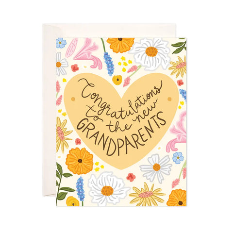 White card with orange, blue, yellow, and pink floral illustrations and an orange heart. Black text within the heart reads "congratulations to the new grandparents"