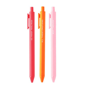 Three pens in the following colors: red pink, orange, and light pink