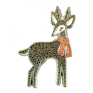 Dark brown enamel pin in the shape of a deer. Gold details. 