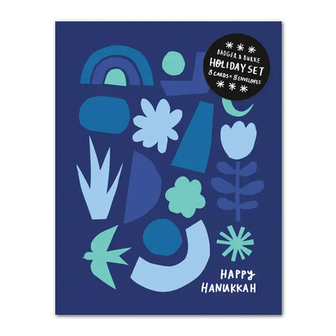 Blue card with abstract shapes in shades of blue. Inside of card is white.