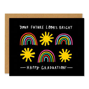 Black card with rainbows and suns. White text reads "your future looks bright; happy graduation." Inside of card is white.
