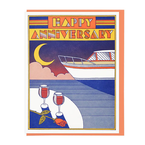 White card with illustration of a cruise ship and two glasses of wine and a rose. Orange text reads "happy anniversary" 