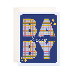 White card with blue background. Block letters filled in with green, red, yellow, and blue plaid spell out BABY. White text reads "hello." 