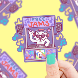 White dog at a purple DJ booth. Blue text reads "free" and red text reads "jams"