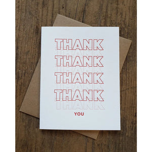 White card with red and white text repeating "thank" and red text "you" 