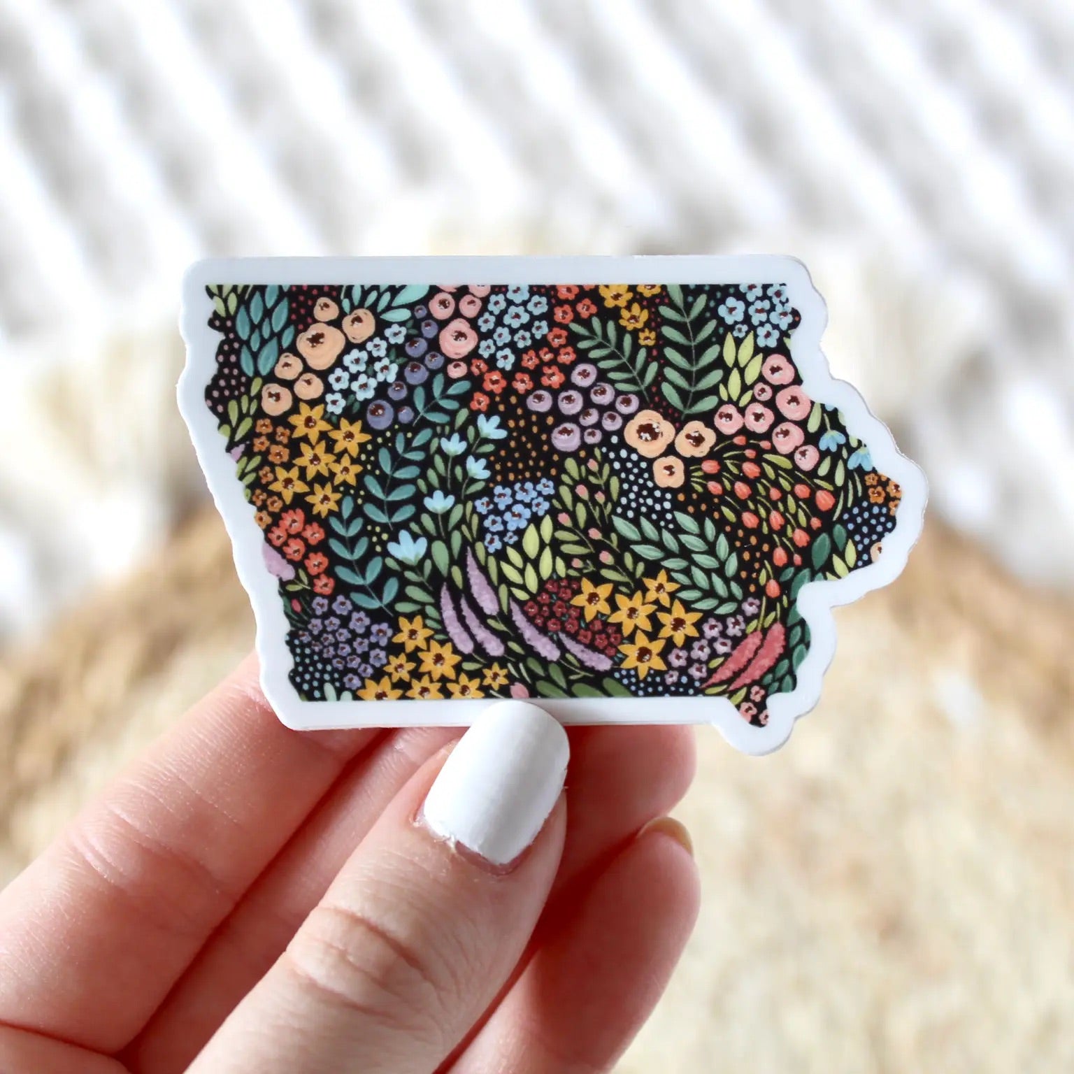Sticker in the shape of Iowa filled in with flowers