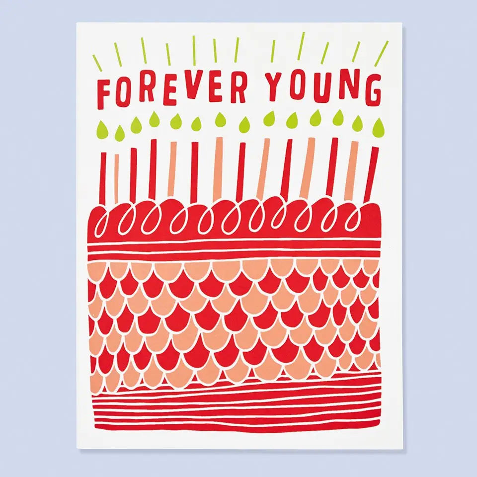 White card with red and orange cake topped with candles. Red text reads "forever young" 