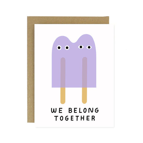 White card with two purple popsicles. Black text reads "we belong together"