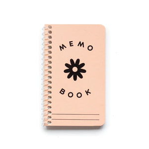 Light pink notebook cover. Black ink flower drawing and black ink text reads "memo book"