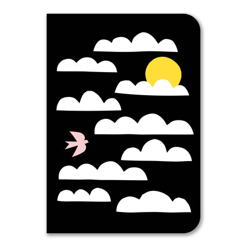 The notebook cover is a black background with white clouds, a yellow sun, and a light pink bird. 