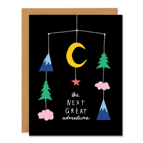 Black card with colorful baby mobile. White text reads "the next great adventure." Inside of card is white.