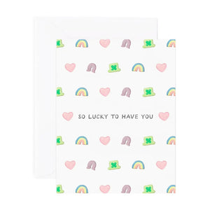 White card with Lucky Charms marshmallow illustrations. Black text reads "so lucky to have you"