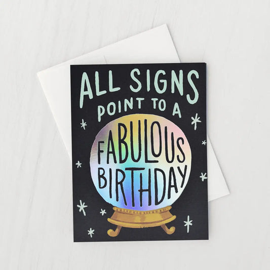 White card with a black background and an iridescent silver crystal ball. Silver text reads "all signs point to a." and black text on the crystal ball reads "fabulous birthday"