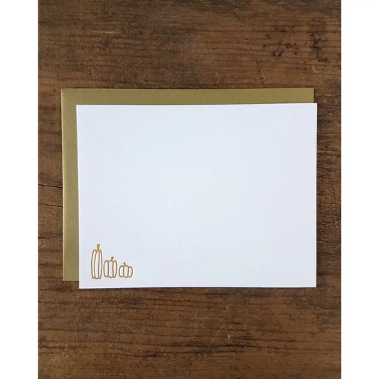White notecard with orange-brown pumpkins in the lower left corner