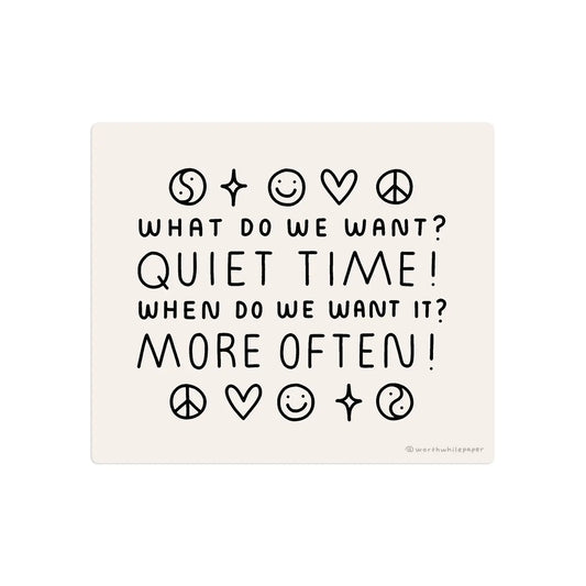 Rectangle-shaped sticker. Light pink background with black text that reads "What do we want? Quiet time! When do we want it? More often!" Black ink drawings of peace signs, smiley faces, yin yangs, hearts, and stars
