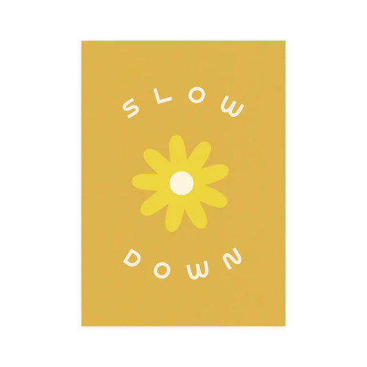 Dark yellow background. White text reads "slow down." Lighter yellow flower drawing in middle. 