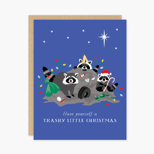 Blue card with illustration of raccoons on a holiday trash heap. White text reads "have yourself a trashy little Christmas." Card is white inside.